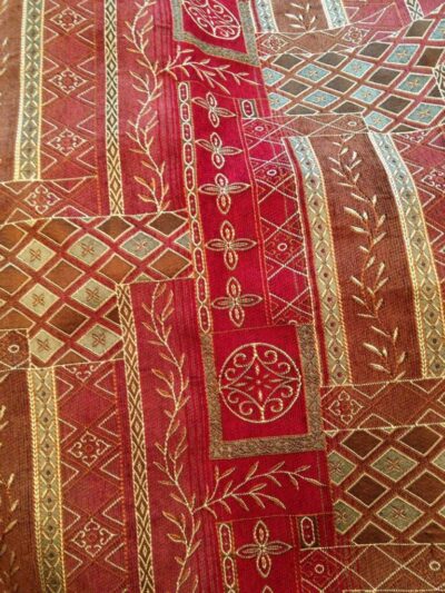 Fabric choice for a bodice red and gold vine design