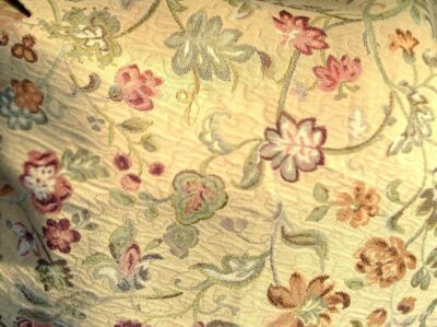 Fabric for a Bodice Green Vines with Flowers and a Golden Background