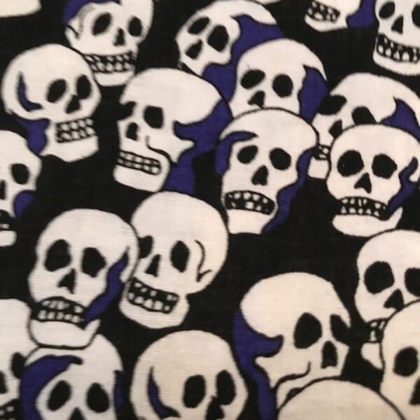 skulls with blue on black fabric