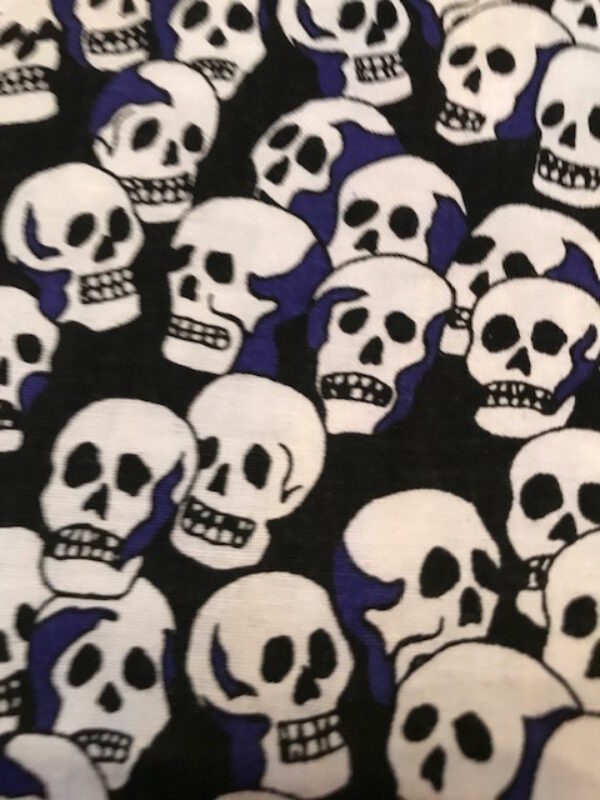 skulls with blue on black fabric